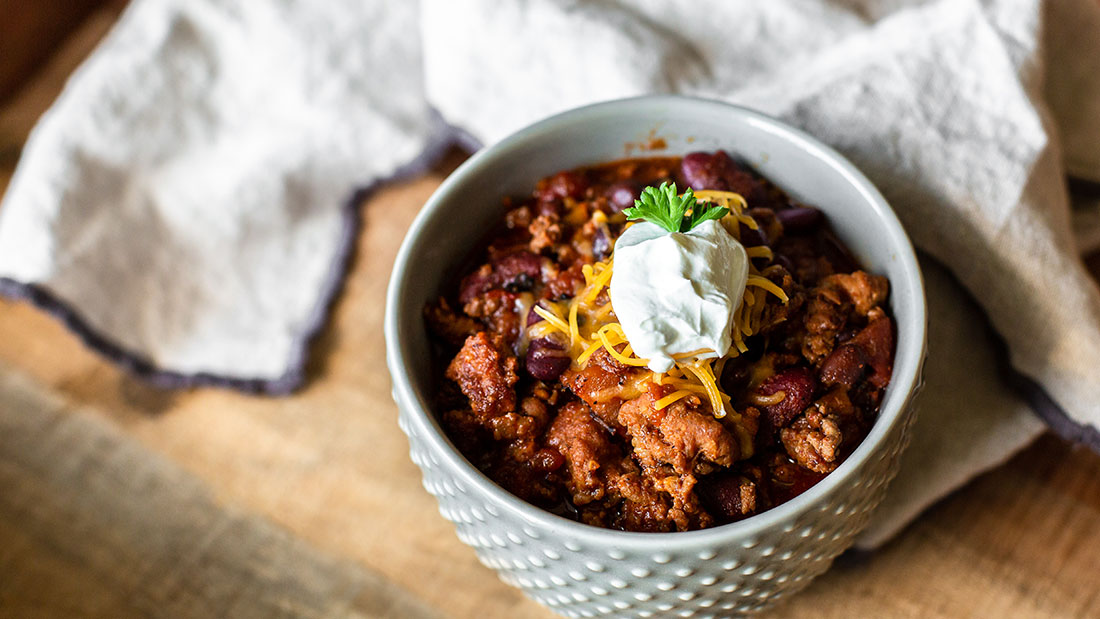 bowl of chili with sour cream
