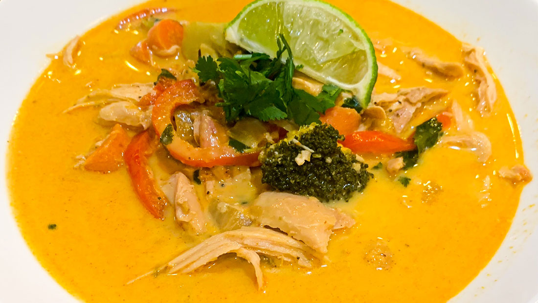 a bowl of coconut curry chicken soup